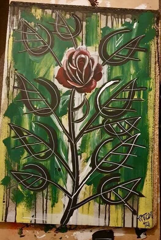 Graphic red rose painting on board with green drip background